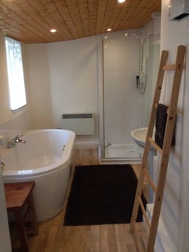 House bathroom with large bath and separate shower.